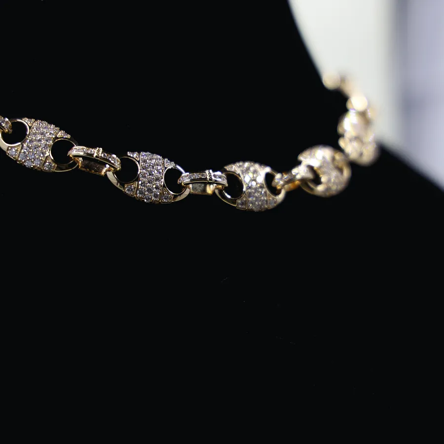 The Taylor.wtf custom link chain, photographed on a display bust