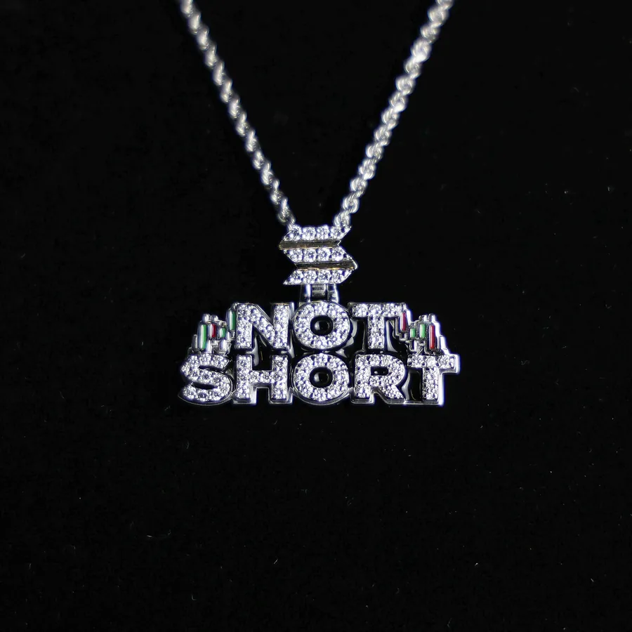 A NOT SHORT nameplate pendant in white gold with pavé diamonds
