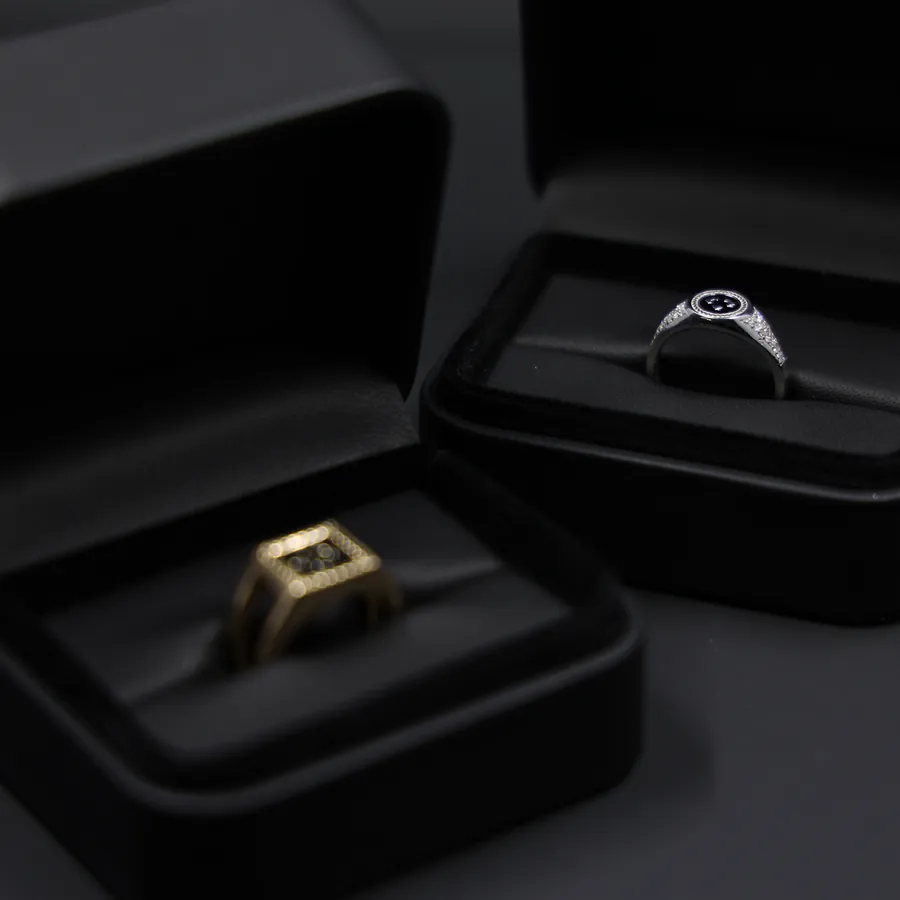 Two finished rings in CryptoJeweler presentation boxes